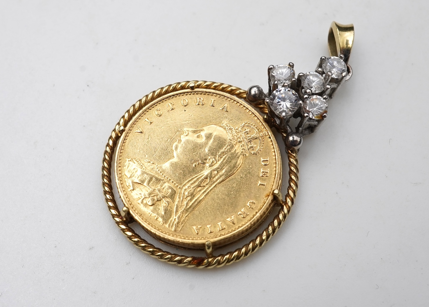 A gold half sovereign pendant, circa 1887 and later